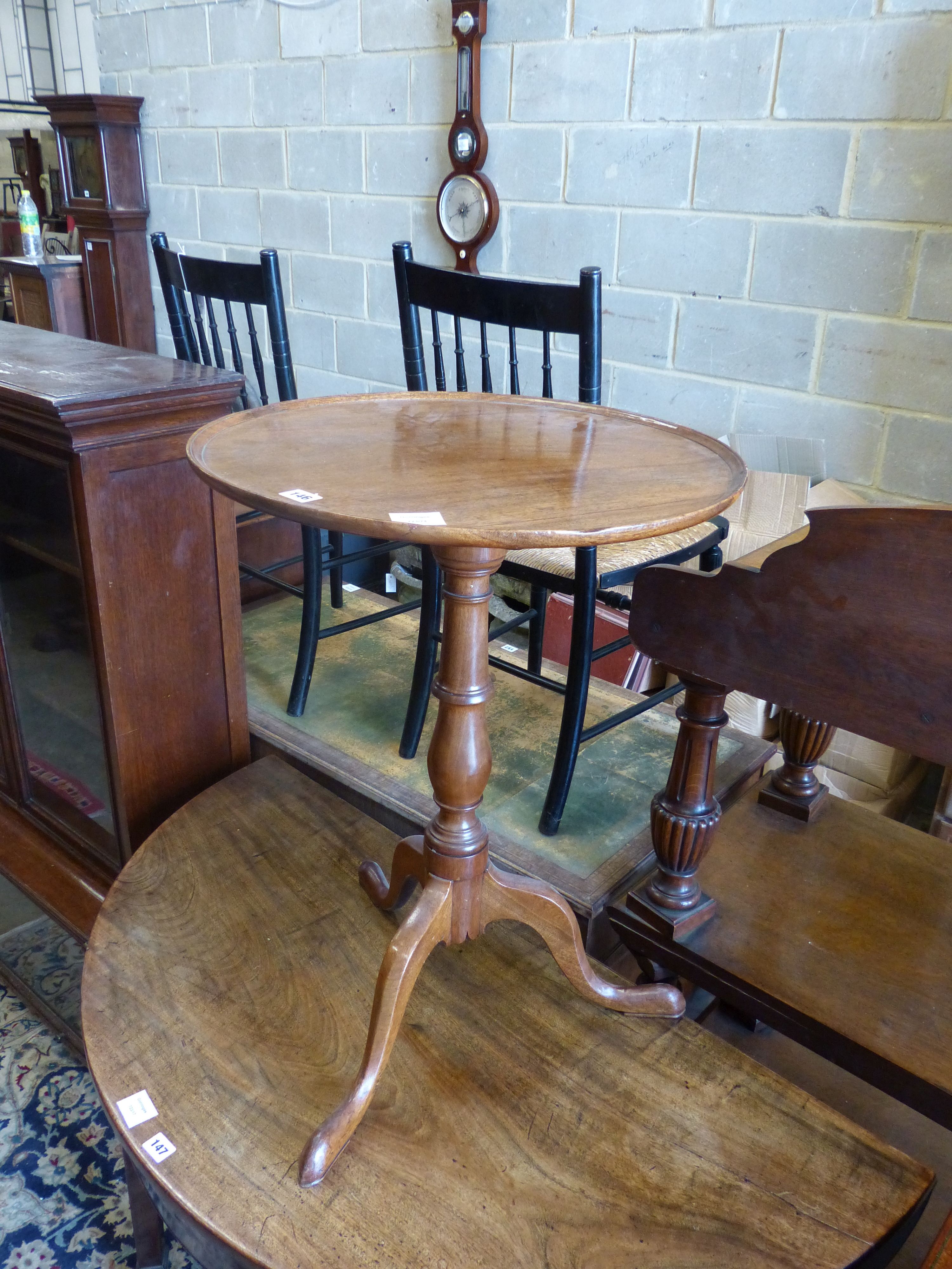A George III circular mahogany tilt top tripod table, diameter 52cm, height 71cm